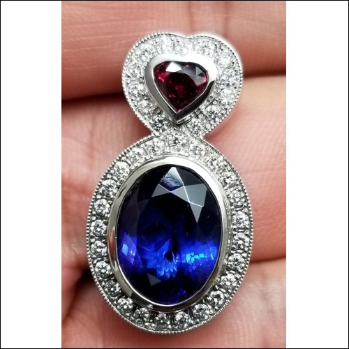 Order for $15,553 11.41Ct Tanzanite Ruby and Diamond Pendant 18kwg