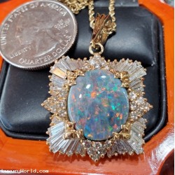 $4,000-$5,000 estate 8.81ctw Gia certified natural play of.color Opal and Diamond Pendant 14k